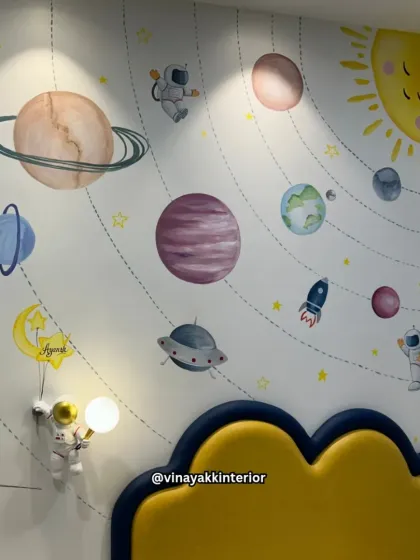 The full view of the solar system wall mural, complete with planets, stars, rockets, and astronauts. This vibrant and educational artwork serves as the perfect backdrop for a young explorer's bedroom.