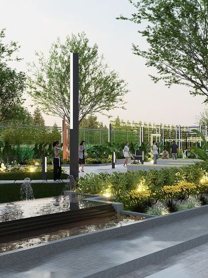 A linear water feature runs alongside the main walkway in Letizia Park, adding a calming auditory element to the space. The design combines hardscape, water, and softscape with integrated lighting to create a multi-sensory experience for evening visitors.