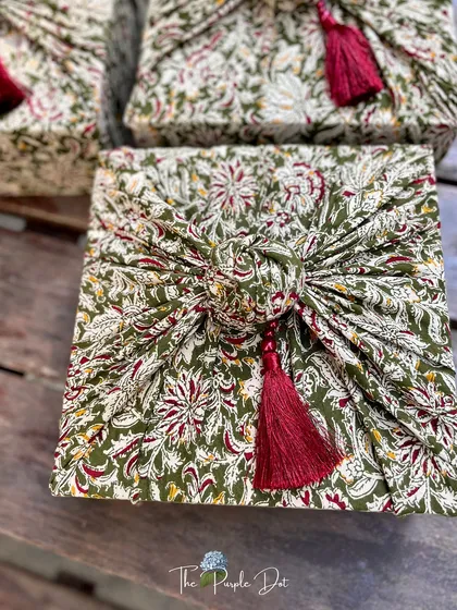 My approach to gifting is rooted in tradition and crafted with intention. This Furoshiki-style fabric wrapping, using beautiful Kalamkari cloth and a fine tassel, transforms a simple box into a piece of art. It’s a sustainable and elegant choice that honors heritage while feeling completely timeless.