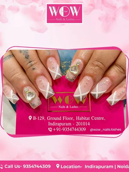 For the ultimate glam, these square extensions are adorned with silver glitter, intricate white line work, and large, sparkling 3D heart and bow charms. A true statement set.