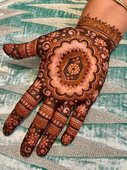 A beautiful mandala design with a hexagonal center and floral details. The use of negative space filling makes the intricate patterns pop, creating a rich and full look.