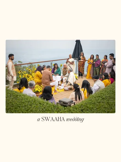 An intimate Chooda ceremony set on a wooden deck overlooking a valley. The setup is simple and elegant, with sunflowers and a close gathering of family.