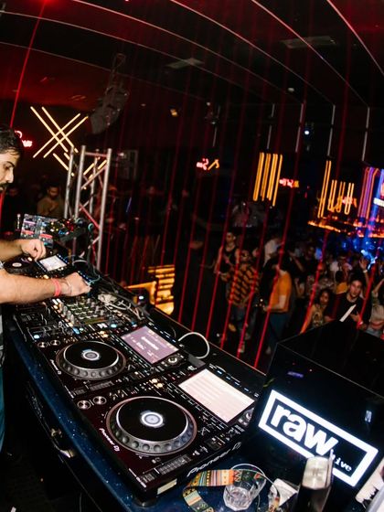 A side view from the console, showing the packed crowd and the impressive setup at Soho Delhi.