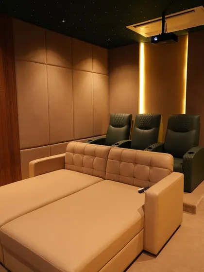 This completed home theater in Nellore shows how I combine different seating styles, like a comfortable daybed and premium recliners, to create a flexible space for the whole family. The project started as a bare room and was transformed into this cinematic retreat.