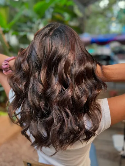 The back of this beautiful wedding hair. The deep brown color is timeless and sophisticated, perfect for a bride.