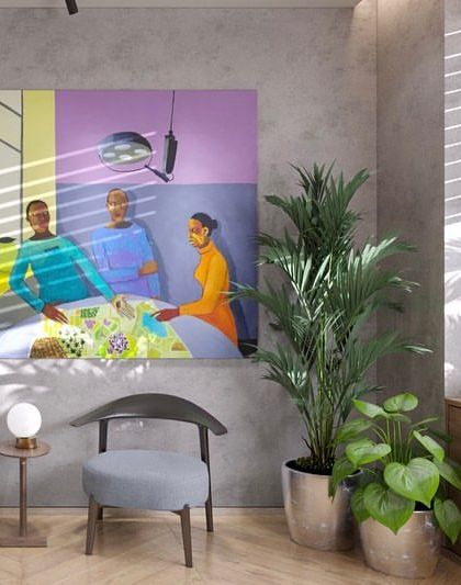 A waiting area that feels more like a contemporary living room. The colorful artwork, comfortable seating, and natural light from the window create a welcoming and relaxed space for visitors.