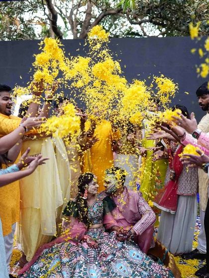 Another angle of the 'phoolon ki holi', capturing the sheer volume of petals and the happy expressions on everyone's faces.