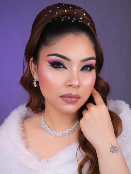 Dive into a world of glam and creativity with this purple and pink graphic eye makeup. The white liner detail adds a futuristic touch, perfect for a creative portfolio.
