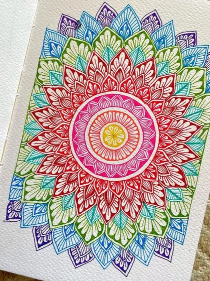 A burst of rainbow colors in my sketchbook using new fineliners. I love how vibrant colors can completely change the energy of a traditional mandala design.