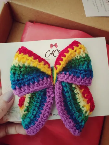 Our rainbow butterfly-style bow is another one of my original designs. The shape is unique and the colors are so vibrant.