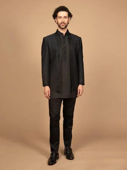 A full-length view of the black embroidered Bandhgala set. This outfit is a perfect fusion of tradition and modernity, designed to make a powerful statement.