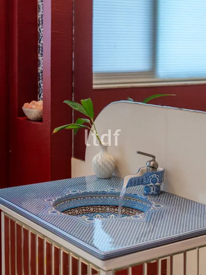 We explored the idea of "Indianness" in this bathroom vanity with vibrant hues and traditional motifs. The intricately patterned washbasin counter and unique tap design bring a regional style to life, adding an element of handcrafted intrigue.