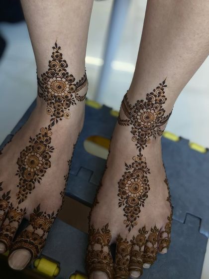 Both feet adorned with the symmetrical and elegant design.