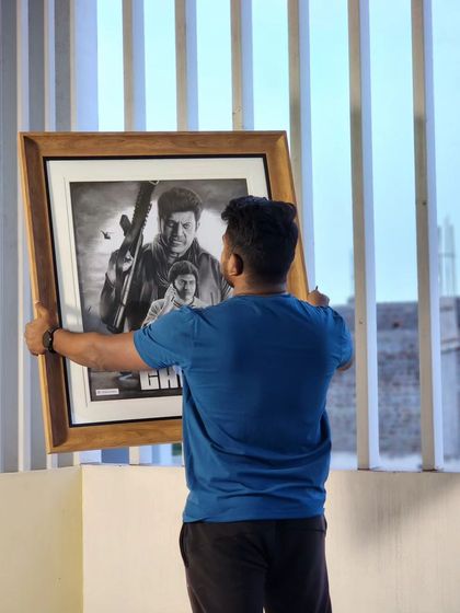 Another shot of me holding the framed 'Ghost' sketch.