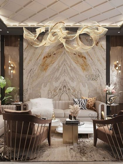 A contemporary living room that is dramatic and personalized. A book-matched marble wall serves as a stunning backdrop, complemented by a modern sculptural chandelier and comfortable, stylish seating.