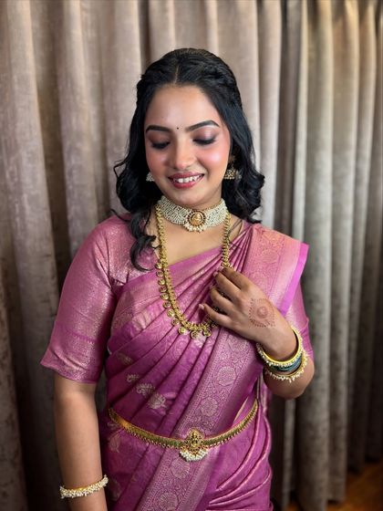 The bride looking down, a serene moment captured beautifully.