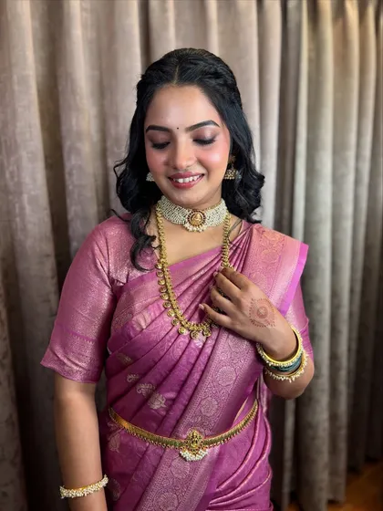 The bride looking down, a serene moment captured beautifully.