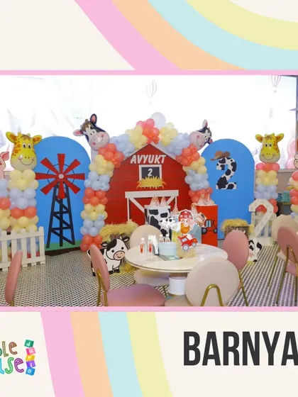 The Barnyard theme is adorable for younger children, with a red barn backdrop and balloon animals like cows and giraffes.