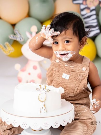 The aftermath of a good cake smash. A happy, messy face is the sign of a successful session. I love capturing these funny and adorable details.