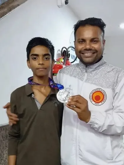 A proud moment for our student Shiva and me, holding the silver medal he won at the nationals.