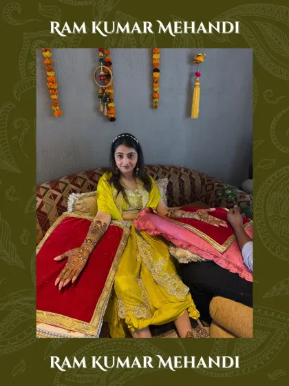A beautiful shot of a bride with her arms outstretched, showing off the full extent of her intricate bridal mehandi.