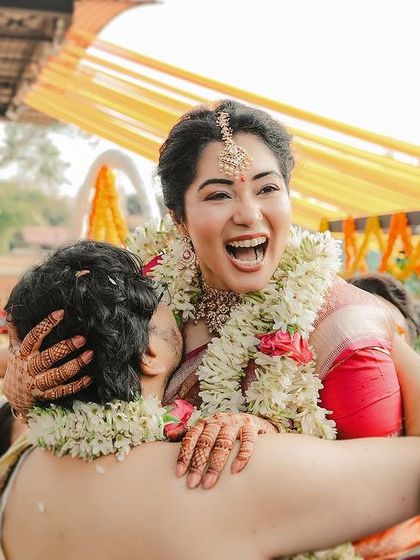 A stunning, wide-angle shot capturing the infectious laughter of the bride, Aarati. This image is a testament to the fun and masti that I strive to capture in every wedding.