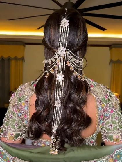 A back view of the half-updo, showing the incredible detail of the hair jewelry.
