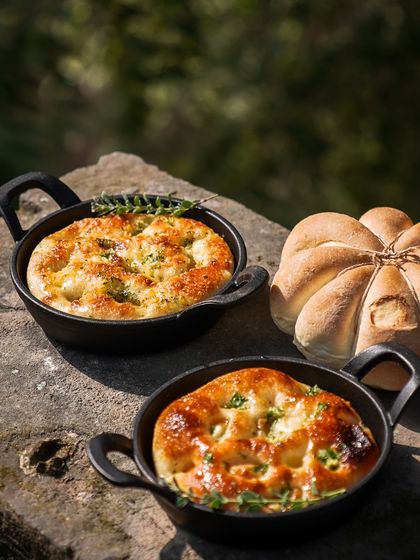 Our festive breads, including a pumpkin-shaped loaf and individual focaccias, are a beautiful and delicious addition to any Christmas table.
