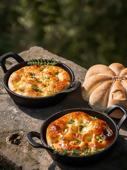 Our festive breads, including a pumpkin-shaped loaf and individual focaccias, are a beautiful and delicious addition to any Christmas table.