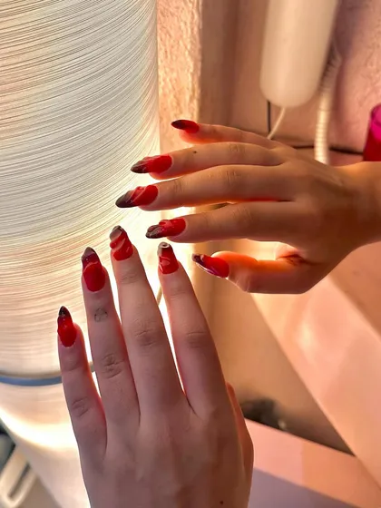 A fiery red set with abstract black and white details. This hand-painted design is bold, dramatic, and full of passion.
