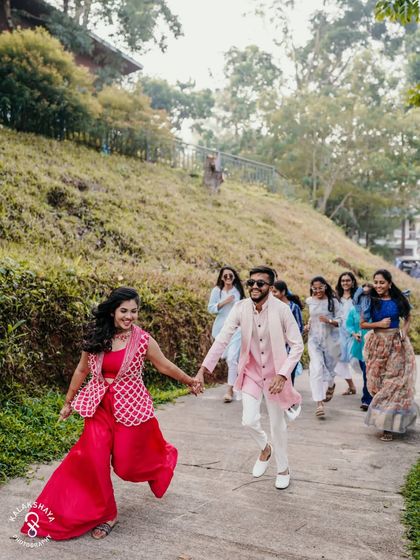 The couple and their friends running down a path, full of energy and excitement.