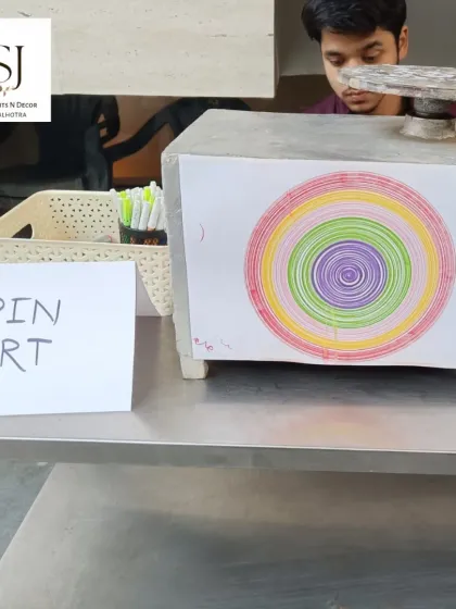A glimpse of the creative activities we offer. This station at a party in GK-1, Delhi, features Spin Art, a mesmerizing way for guests to create unique art pieces.
