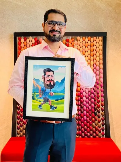 A happy client holding his framed digital caricature. I provide high-quality prints and framing, so your artwork is ready to be displayed and enjoyed.