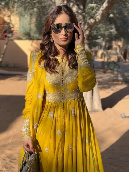 The final look. The yellow Anamika Khanna outfit and the golden makeup are a perfect match for a sunny Haldi day.
