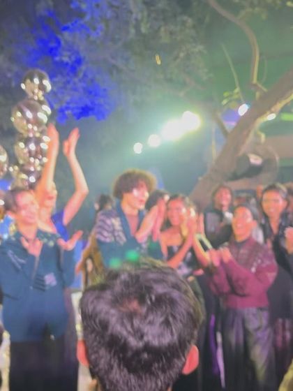 The joy and applause from the audience and models during the show's closing moments.