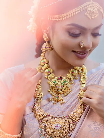 A dreamy, soft-focus shot of a model in a traditional muhurtham look.