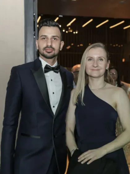 I am proud to serve a diverse and international clientele. Here, a client is seen looking sharp and confident in a custom-tailored navy blue tuxedo, perfect for a gala or formal event.