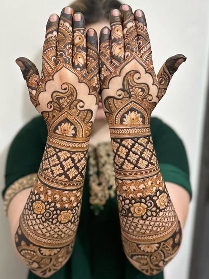 A beautiful design for the back of the hands, with large, flowing paisley and floral patterns.