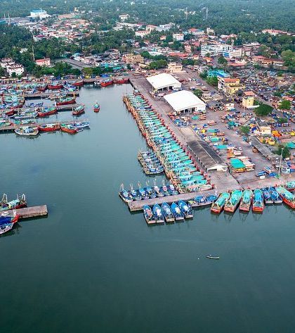 A duplicate of image 11, providing another look at the sprawling Malpe fishing harbour from an aerial perspective.