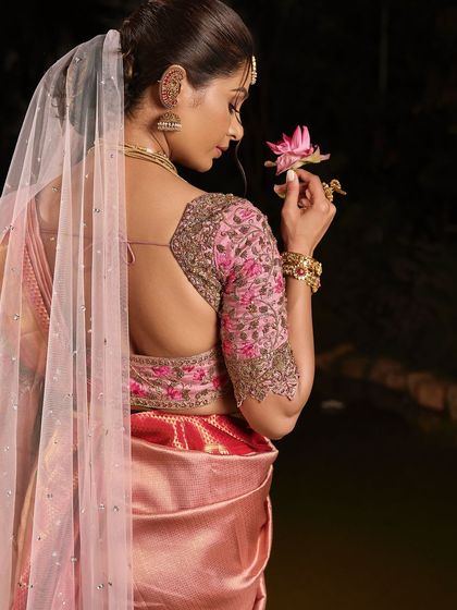 The back view of this stunning look, showing the elegant hairstyle and the beautiful drape of the veil.