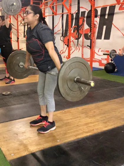 A female client in the hang position. We work extensively on this to improve efficiency and strength in the second pull of the snatch.