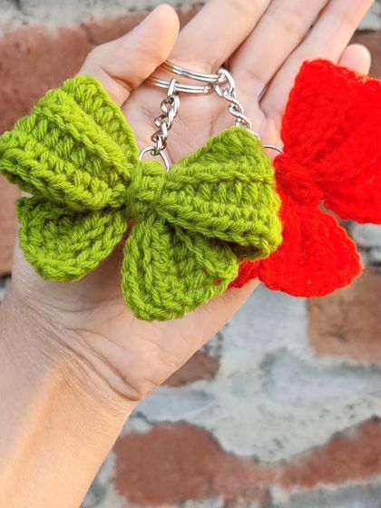 Coquette bow keychains available in a whole spectrum of colors, from bold reds and pinks to earthy tones.