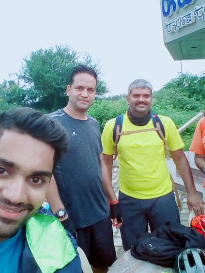 Taking a quick break at a roadside shop. Long-distance cycling is as much about the journey and the stops as it is about the destination.