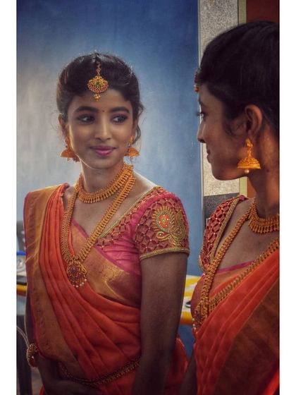 A candid moment showing the final look. The makeup is flawless from every angle, designed to look great both in person and in photographs.