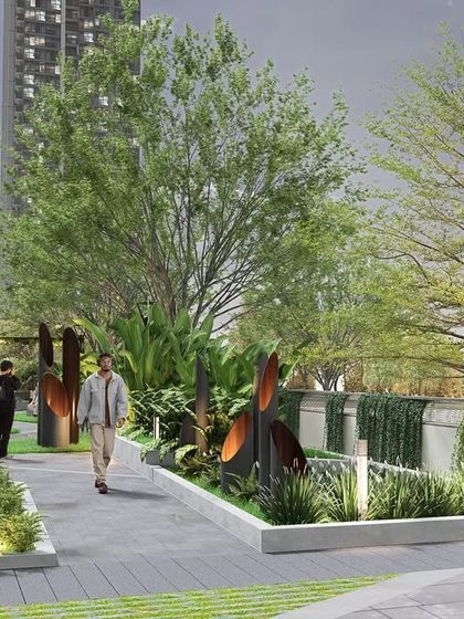 A pedestrian pathway at Kailash Apartments, designed with sculptural elements and layered plantings. The path provides a beautiful and functional connection between different areas of the complex, promoting a walkable and active lifestyle.