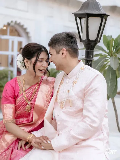 Laughter and love. This couple's joy is palpable, and their coordinated outfits add to the beauty of the moment.