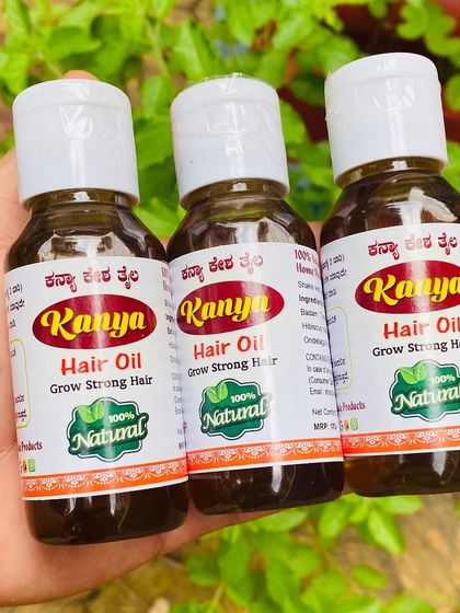 Three bottles of Kanya Hair Oil held up close. This is my homemade, natural solution for stronger, shinier hair.