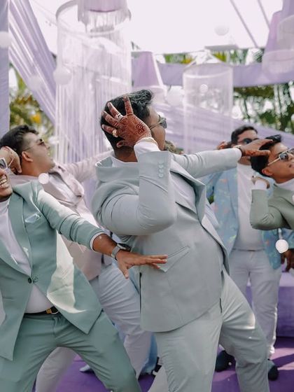 More fun on the dance floor with the groom and his friends. These high-energy shots are a testament to a great celebration.