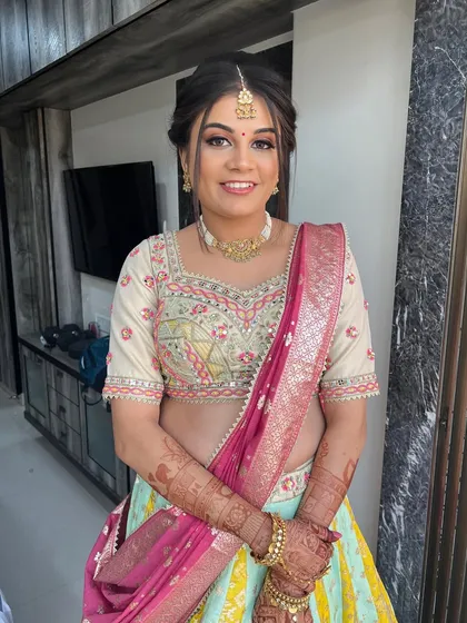 A smiling shot of the baby shower bride, her makeup looking fresh and beautiful.