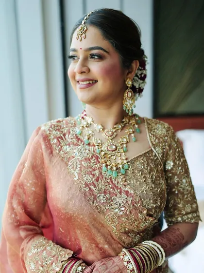 A candid shot capturing her natural smile. The makeup is subtle enough to let her personality shine through, which is always my ultimate goal.